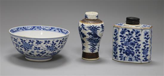 An 18th century Chinese blue and white tea caddy and bowl, and a later vase, (3)